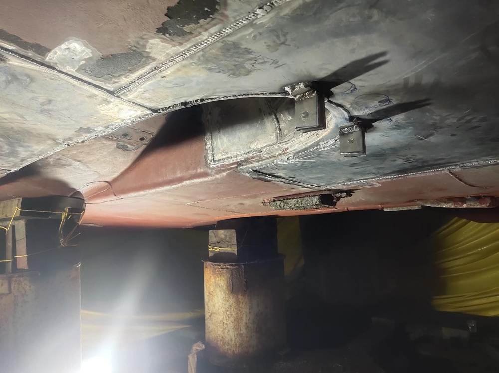 Welder at work on a vessel hull